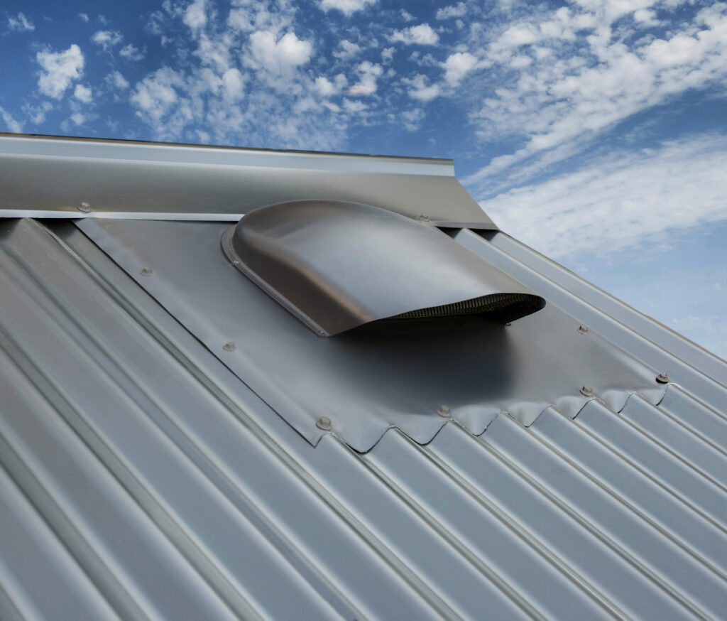 Low profile roof vent on mental roof